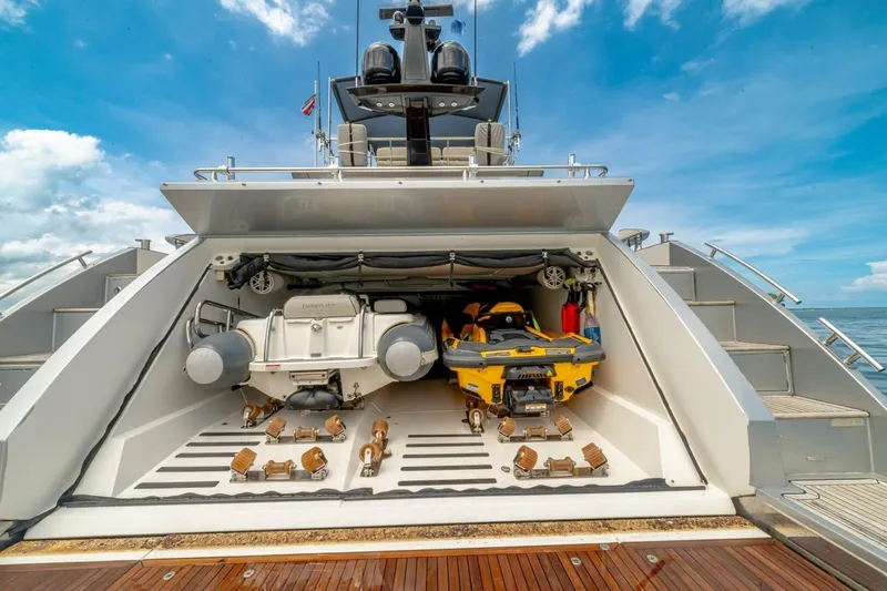 Carpe Diem Yacht Photos Pics 2017 Azimut 77S yacht with open garage, showcasing watercraft storage.