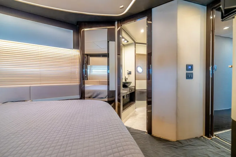 Carpe Diem Yacht Photos Pics Luxurious interior of 2017 Azimut 77S yacht bedroom with ensuite bathroom.