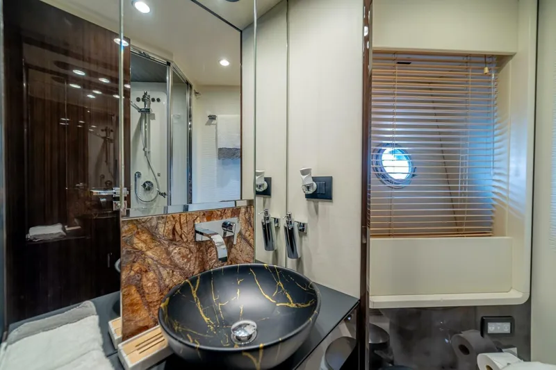 Carpe Diem Yacht Photos Pics Luxurious bathroom on 2017 Azimut 77S yacht with elegant sink and modern fixtures.