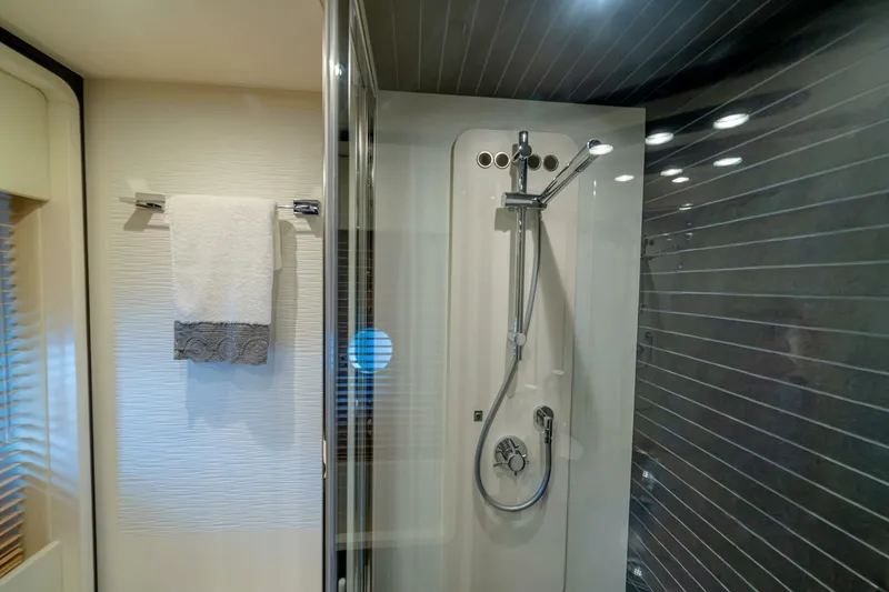 Carpe Diem Yacht Photos Pics Luxurious bathroom in 2017 Azimut 77S yacht with modern shower and towel rack.