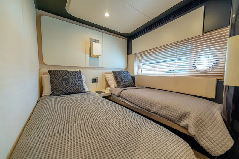 Carpe Diem Yacht Photos Pics Luxurious twin cabin interior on 2017 Azimut 77S yacht with modern decor and cozy bedding.