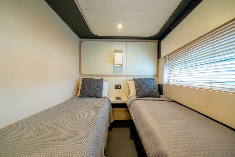 Carpe Diem Yacht Photos Pics Twin bedroom in 2017 Azimut 77S yacht with modern decor and cozy bedding.