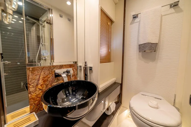 Carpe Diem Yacht Photos Pics Luxurious bathroom in 2017 Azimut 77S yacht with modern fixtures and elegant design.