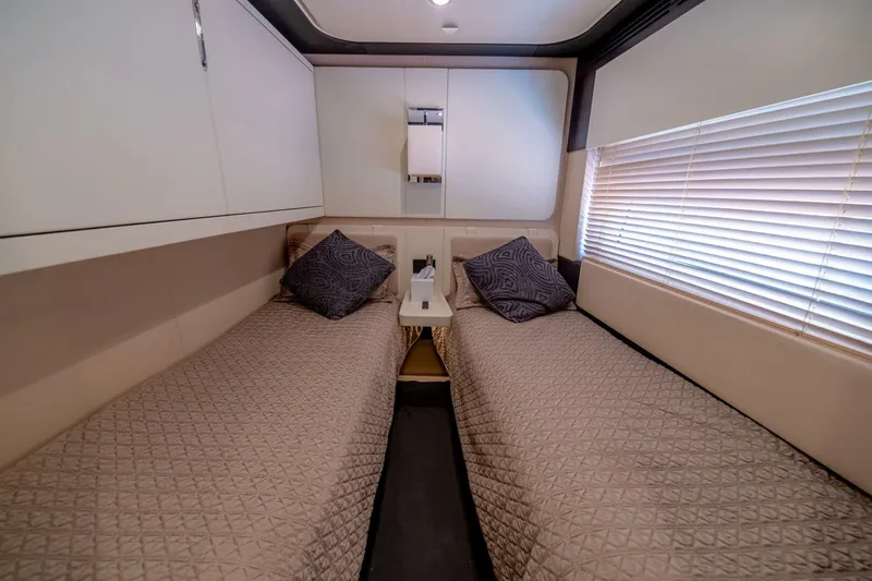 Carpe Diem Yacht Photos Pics Luxurious twin cabin interior of 2017 Azimut 77S yacht with elegant bedding and decor.