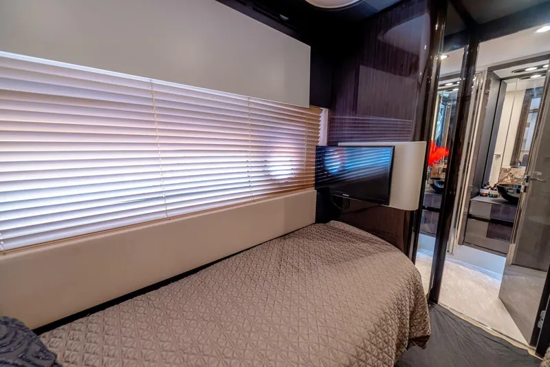 Carpe Diem Yacht Photos Pics Luxurious 2017 Azimut 77S yacht bedroom with modern decor and flat-screen TV.