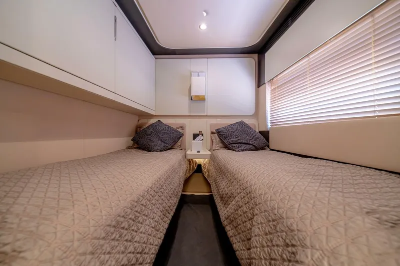 Carpe Diem Yacht Photos Pics Luxurious twin cabin interior on 2017 Azimut 77S yacht, featuring elegant bedding and modern design.