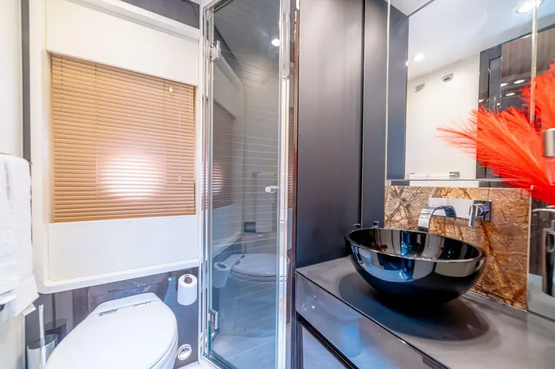 Carpe Diem Yacht Photos Pics Luxurious bathroom in 2017 Azimut 77S yacht with modern fixtures and elegant design.
