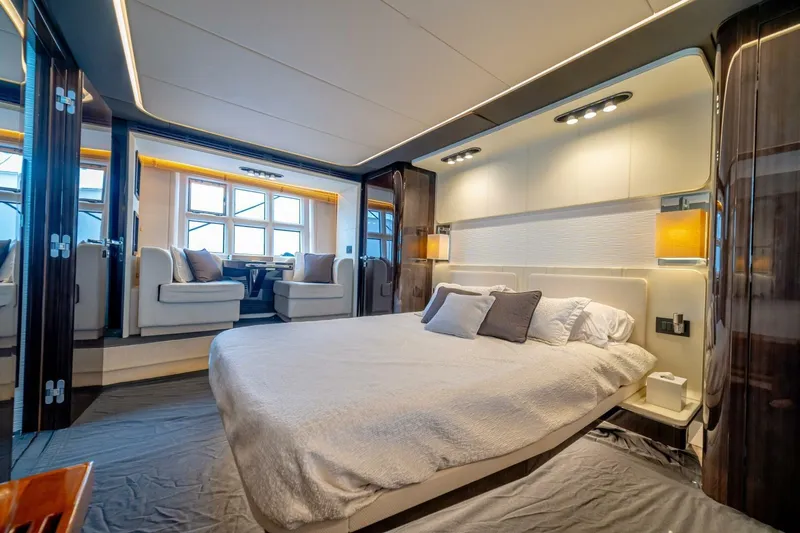 Carpe Diem Yacht Photos Pics Luxurious bedroom interior of 2017 Azimut 77S yacht with modern design and elegant furnishings.