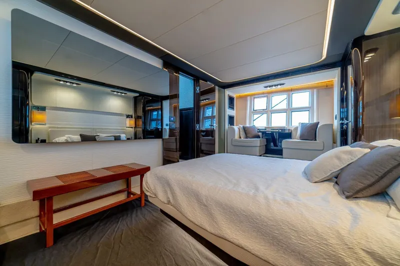 Carpe Diem Yacht Photos Pics Luxurious interior of 2017 Azimut 77S yacht with elegant bedroom and seating area.