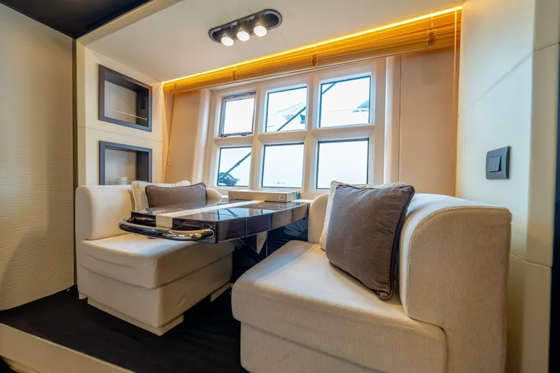 Carpe Diem Yacht Photos Pics Luxurious interior of 2017 Azimut 77S yacht with elegant seating and modern decor.