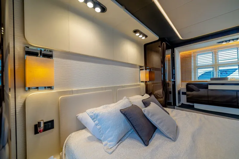 Carpe Diem Yacht Photos Pics Luxurious bedroom interior of 2017 Azimut 77S yacht with modern lighting and elegant decor.