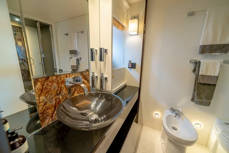 Carpe Diem Yacht Photos Pics Luxurious bathroom in 2017 Azimut 77S yacht with modern fixtures and elegant design.