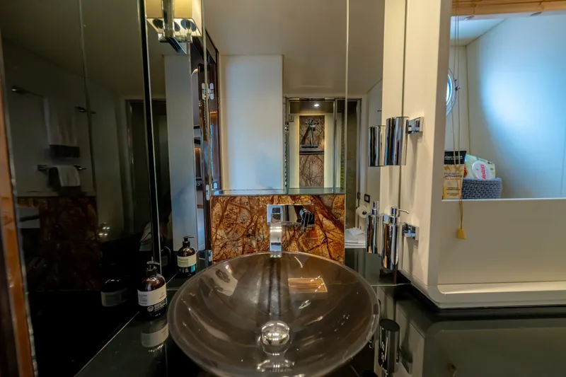 Carpe Diem Yacht Photos Pics Luxurious bathroom interior of 2017 Azimut 77S yacht with modern fixtures and elegant design.