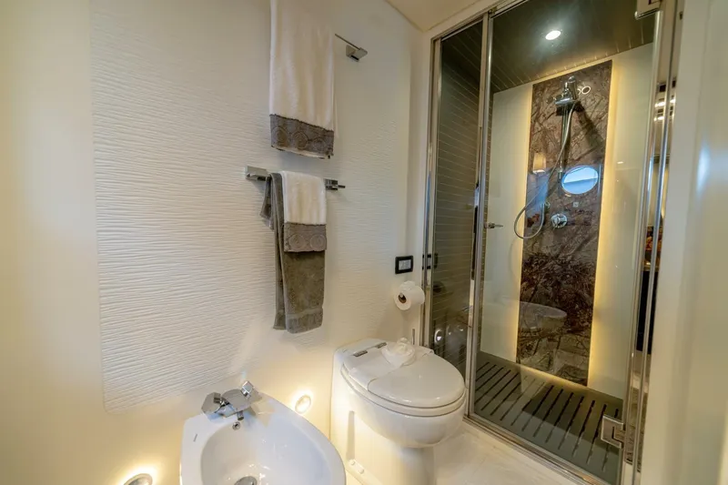 Carpe Diem Yacht Photos Pics Luxurious bathroom in 2017 Azimut 77S yacht with modern shower and elegant fixtures.