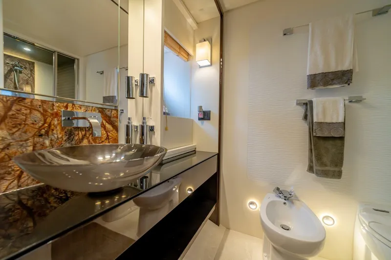 Carpe Diem Yacht Photos Pics Luxurious bathroom in 2017 Azimut 77S yacht with modern sink and elegant decor.