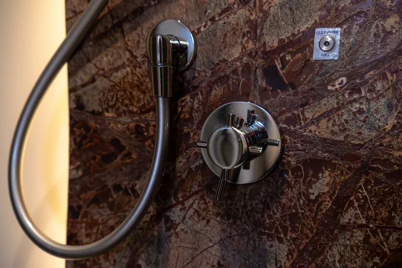 Carpe Diem Yacht Photos Pics Shower controls on Azimut 77S yacht, 2017 model, with elegant marble background.