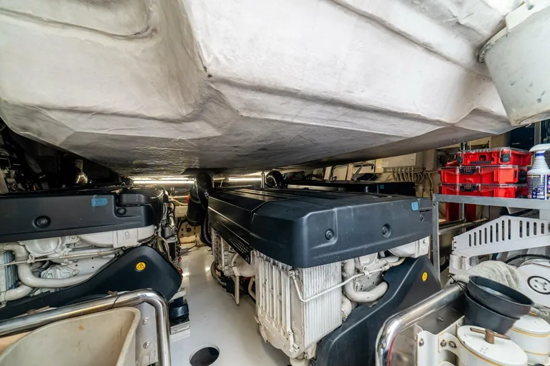 Carpe Diem Yacht Photos Pics Engine room of 2017 Azimut 77S yacht, featuring dual engines and organized storage.
