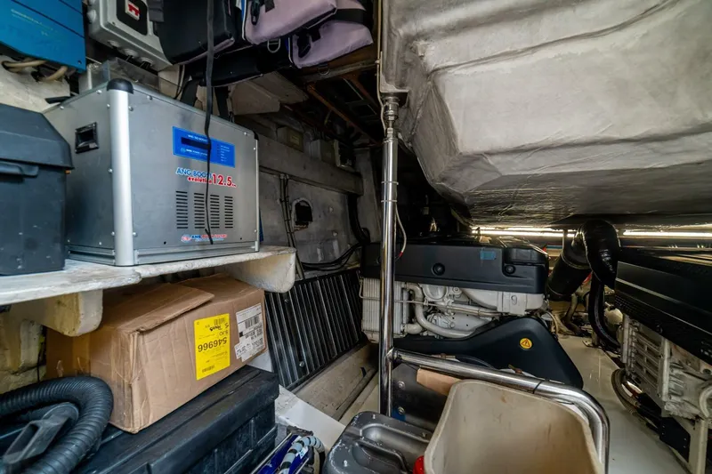 Carpe Diem Yacht Photos Pics Engine room of a 2017 Azimut 77S yacht, featuring equipment and storage.