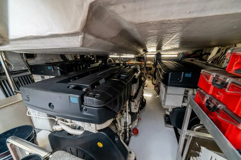 Carpe Diem Yacht Photos Pics Engine room of a 2017 Azimut 77S yacht, showcasing powerful machinery and organized tools.