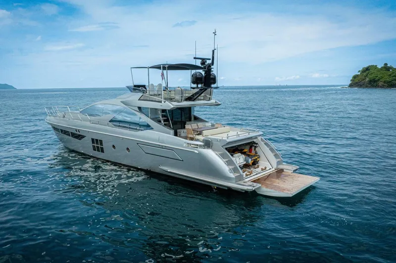 Carpe Diem Yacht Photos Pics Luxury 2017 Azimut 77S yacht cruising on open sea, featuring sleek design and spacious deck.