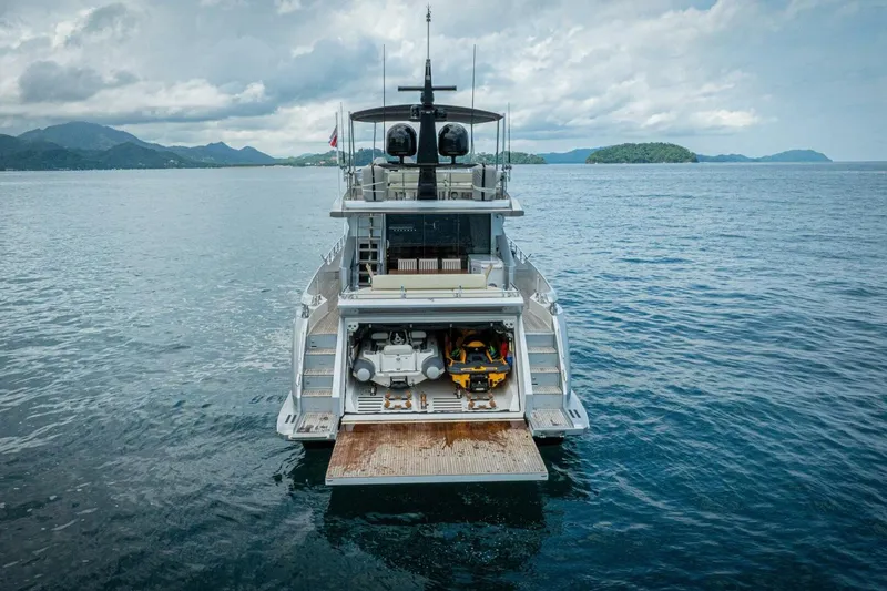 Carpe Diem Yacht Photos Pics Azimut 77S 2017 yacht with open garage and jet ski on calm sea.