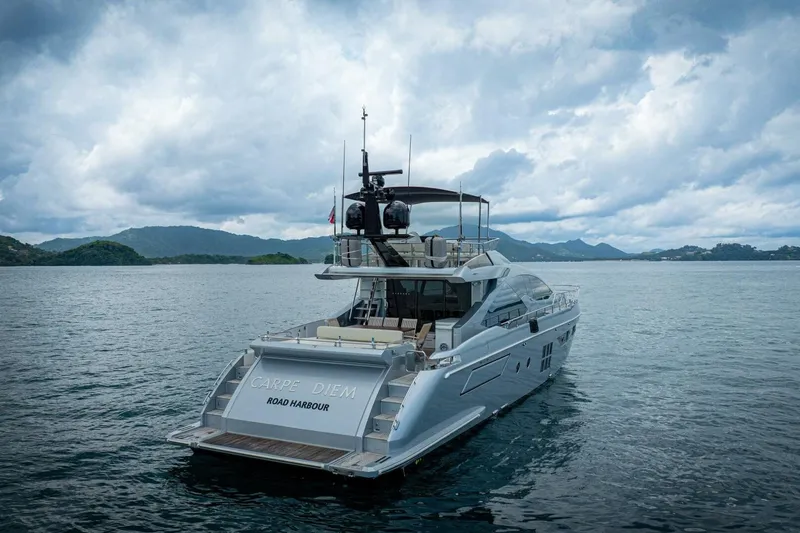Carpe Diem Yacht Photos Pics Luxury 2017 Azimut 77S yacht "Carpe Diem" on serene waters under cloudy skies.