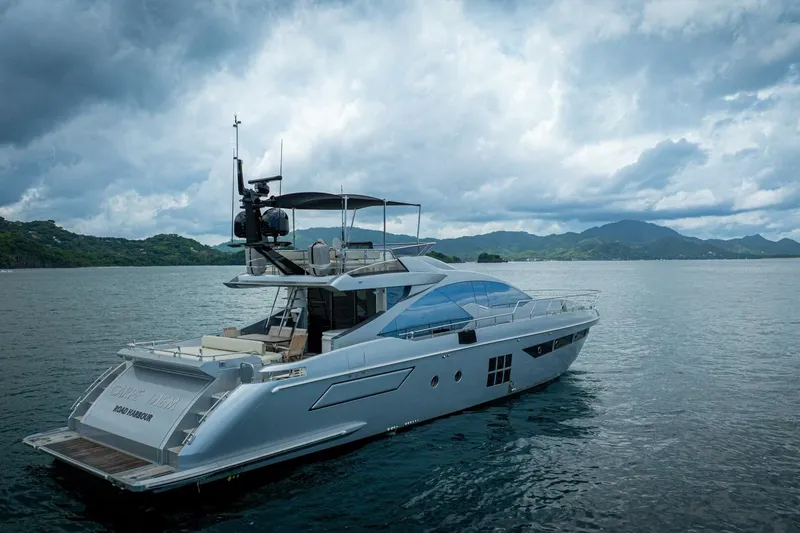 Carpe Diem Yacht Photos Pics Luxury 2017 Azimut 77S yacht cruising on scenic waters under cloudy skies.