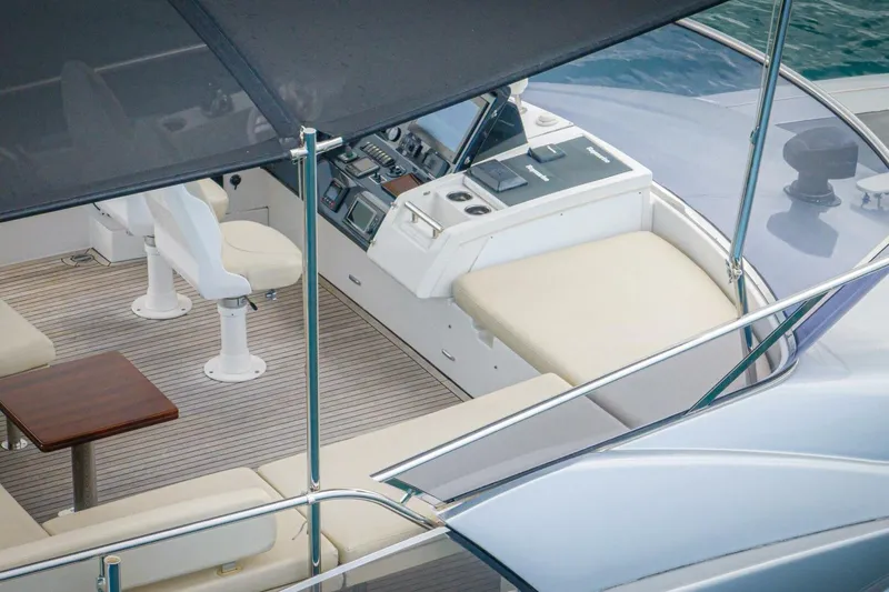 Carpe Diem Yacht Photos Pics Luxurious 2017 Azimut 77S yacht cockpit with modern controls and comfortable seating.