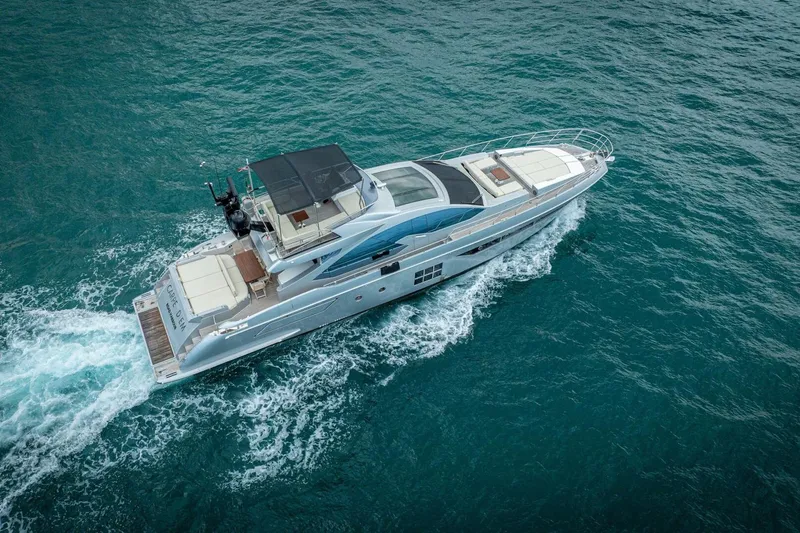 Carpe Diem Yacht Photos Pics 2017 Azimut 77S yacht cruising on open sea, aerial view.