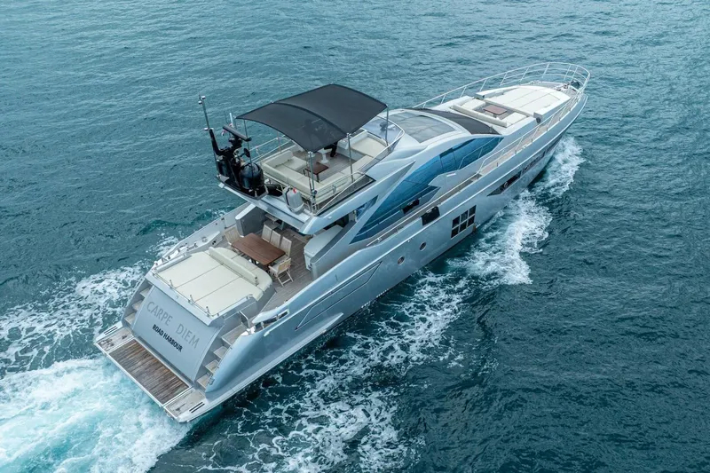 Carpe Diem Yacht Photos Pics Luxury 2017 Azimut 77S yacht cruising on open water, featuring sleek design and spacious deck.