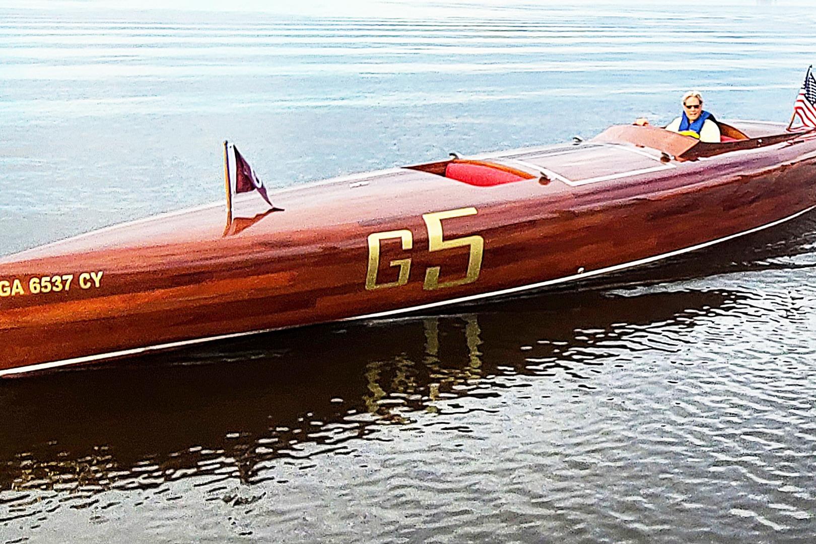 Custom 2024 Treworgy Replica of 30’ Baby Bootlegger boat on calm water.