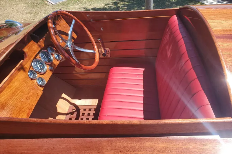  Yacht Photos Pics Interior of 2024 Treworgy Replica 30’ Baby Bootlegger with red leather seats and wooden dashboard.