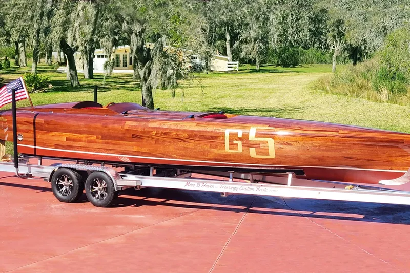  Yacht Photos Pics Custom 2024 Treworgy Replica of 30’ Baby Bootlegger on trailer, displayed outdoors.