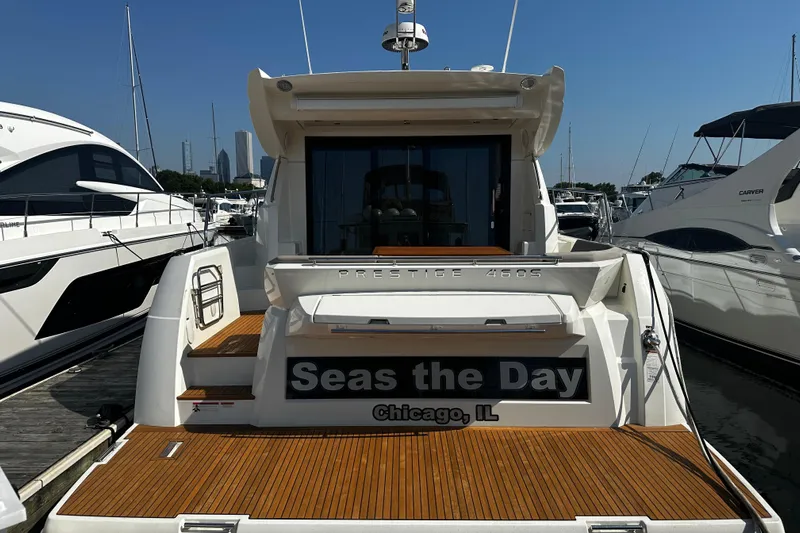 Seas The Day Yacht Photos Pics 2018 Prestige 460 yacht docked, named "Seas the Day," in Chicago marina.