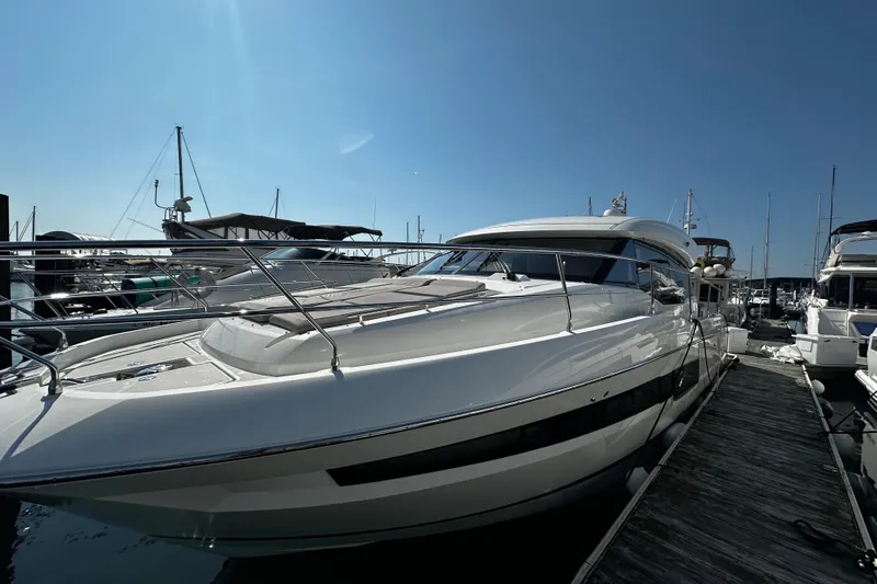 Seas The Day Yacht Photos Pics 2018 Prestige 460 yacht docked at marina under clear blue sky.