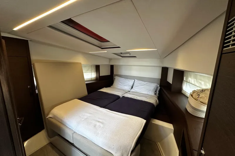 Seas The Day Yacht Photos Pics Luxurious bedroom interior of 2018 Prestige 460 yacht with modern design and cozy bedding.