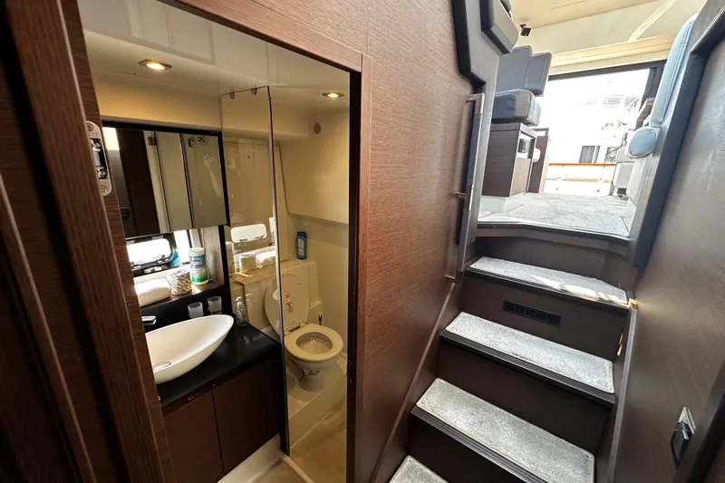 Seas The Day Yacht Photos Pics Interior of 2018 Prestige 460 yacht showing bathroom and stairs to upper deck.