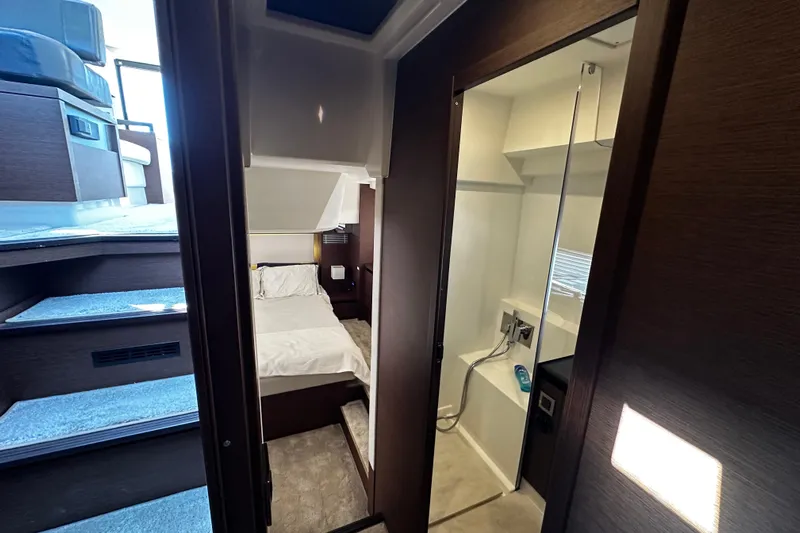 Seas The Day Yacht Photos Pics Interior of 2018 Prestige 460 yacht showing bedroom and bathroom with modern design.