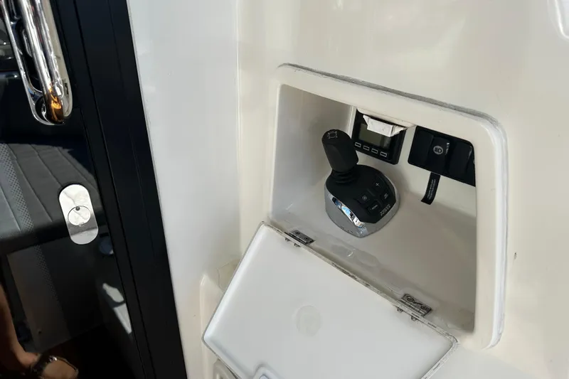 Seas The Day Yacht Photos Pics Control panel on a 2018 Prestige 460 yacht, featuring joystick and switches.