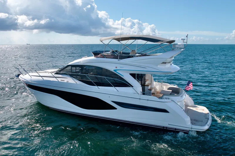  Yacht Photos Pics 2026 Princess F50 yacht cruising on open sea under clear skies.