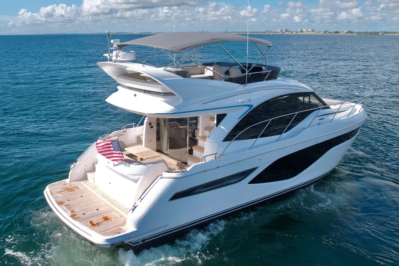  Yacht Photos Pics Luxurious 2026 Princess F50 yacht cruising on open sea under clear skies.