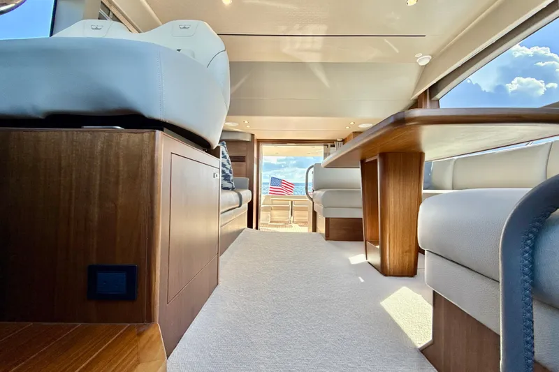  Yacht Photos Pics Luxurious interior of 2026 Princess F50 yacht with elegant seating and wooden finishes.