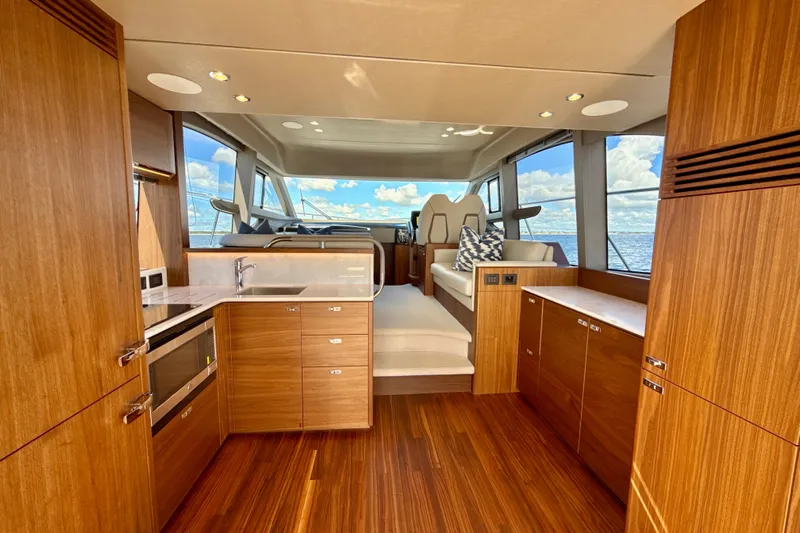  Yacht Photos Pics Luxurious interior of 2026 Princess F50 yacht with modern wood finishes and ocean view.
