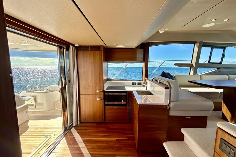  Yacht Photos Pics Luxurious 2026 Princess F50 yacht interior with ocean view, featuring elegant wood finishes and modern design.