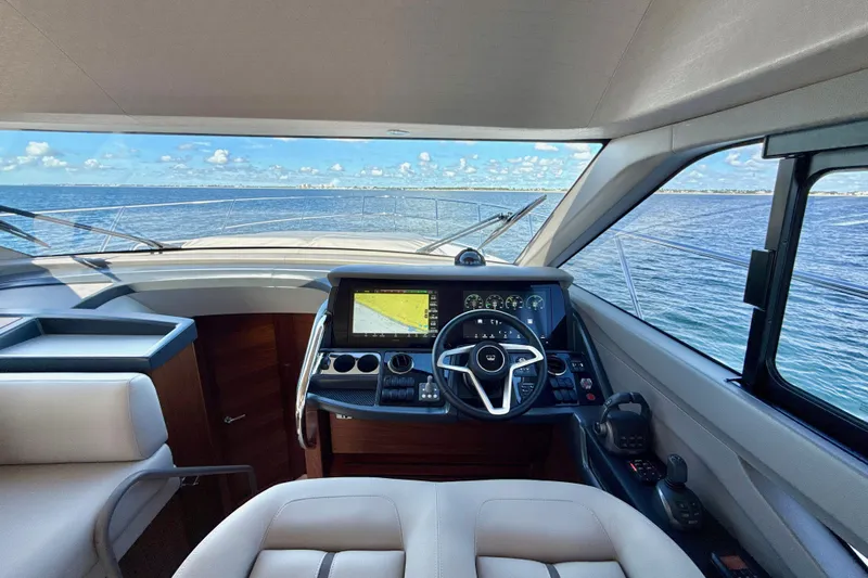  Yacht Photos Pics Interior view of 2026 Princess F50 yacht cockpit with ocean backdrop.