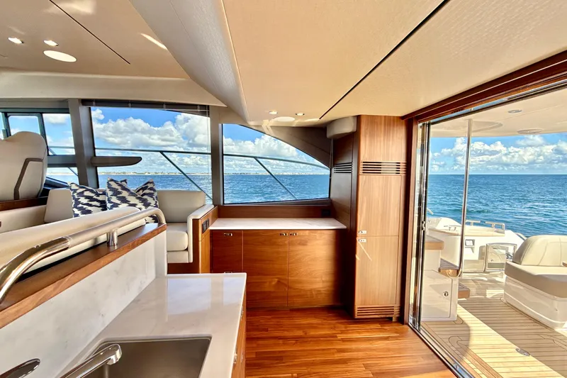  Yacht Photos Pics Luxurious interior of 2026 Princess F50 yacht with ocean view and elegant wood finishes.