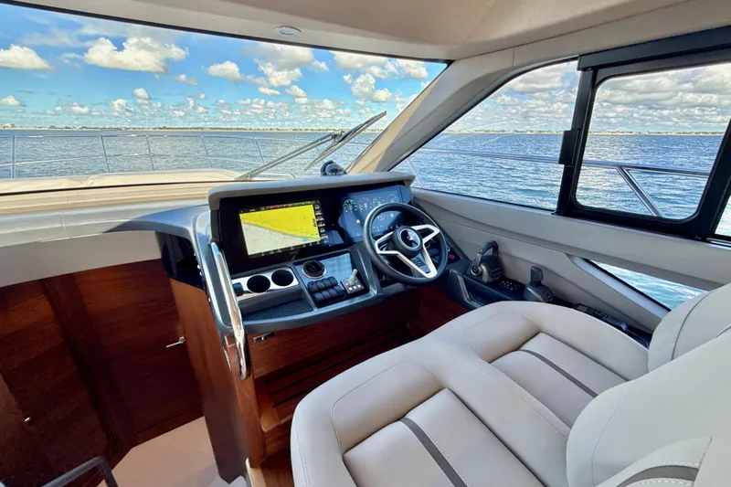  Yacht Photos Pics Luxurious 2026 Princess F50 yacht cockpit with modern navigation system and ocean view.