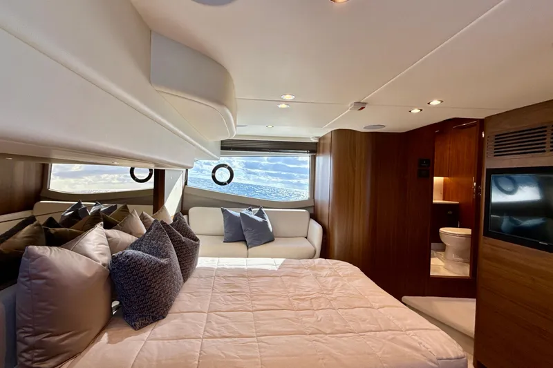  Yacht Photos Pics Luxurious interior of 2026 Princess F50 yacht with elegant bedroom and ocean view.
