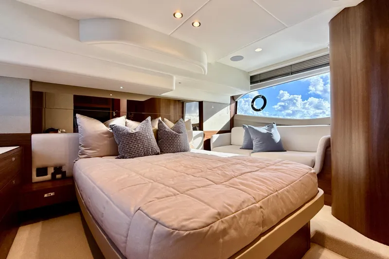  Yacht Photos Pics Luxurious 2026 Princess F50 yacht bedroom with elegant decor and ocean view.
