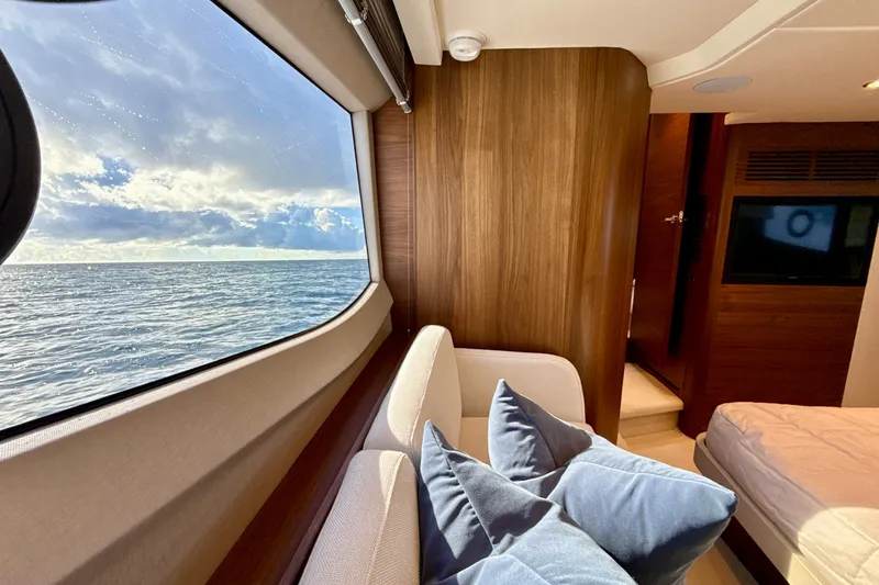  Yacht Photos Pics Luxurious interior of 2026 Princess F50 yacht with ocean view through large window.